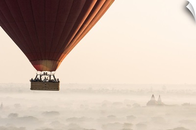 Hot air balloon flying over pagodas in Bagan, Myanmar