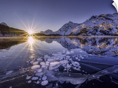 Ice Bubbles Trapped In The Frozen Lake Sils During A Sunset, Engadine, Switzerland