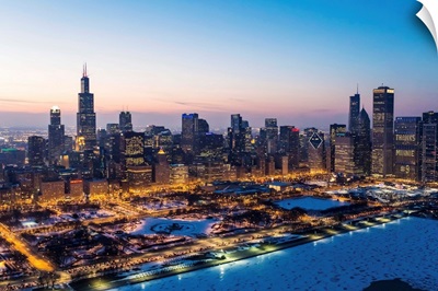 Illinois, Chicago. Aerial dusk view of the city and Millennium Park in winter