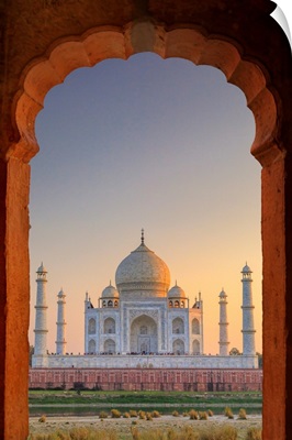 India, Taj Mahal At Sunset Framed By A Temple Arch