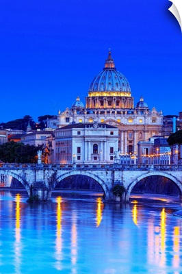 Italy, Rome, St. Peter Basilica by night reflecting on Tevere river