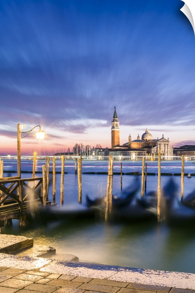 Italy, Veneto, Venice. Row of gondolas moored at sunrise on Riva degli Schiavoni