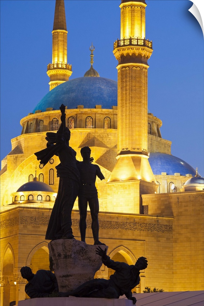 Lebanon, Beirut. Statue in Martyr's Square and Mohammed Al-Amin Mosque at dusk.