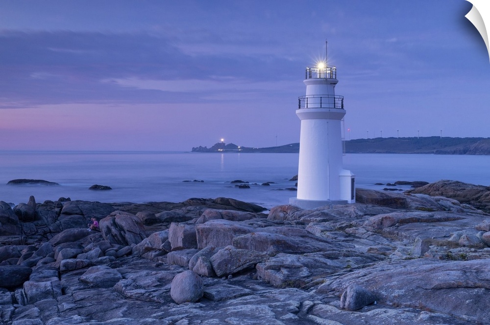 Lighthouse of Muxia at dusk during a summer day, municipality of Muxia, Galicia, Spain.
