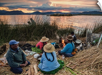 Native Uro Family dining at sunset, Lake Titicaca, Puno Region, Peru