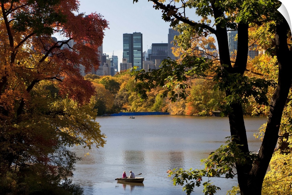 USA, New York City, Manhattan,  Central Park and the Grand buildings along Central Park West viewed across the lake in autumn