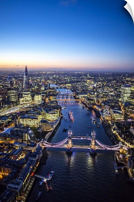 Night aerial view of The Shard, River Thames, Tower Bridge and City of London, England