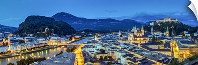 Panoramic view over the old town and Hohensalzburg Castle at dusk, Salzburg, Austria