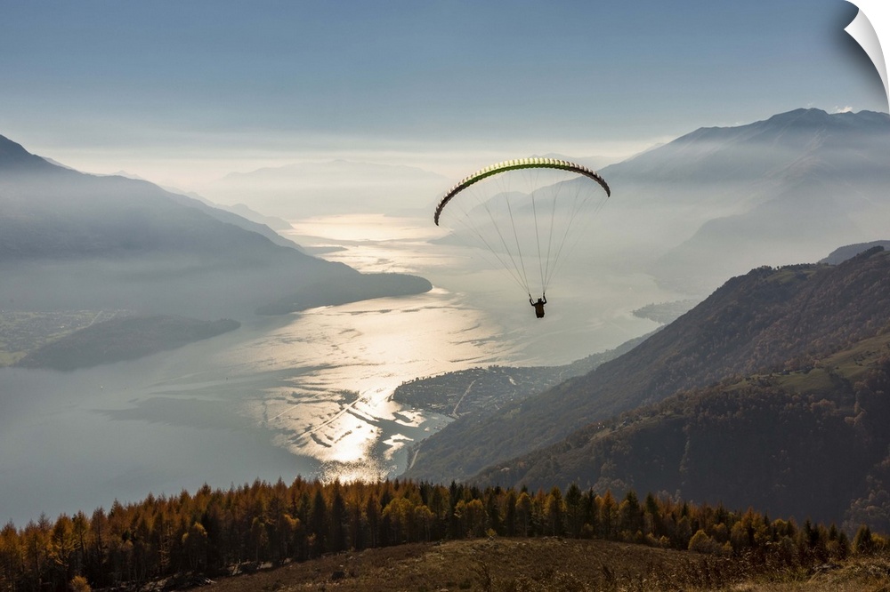 Paragliding over Lake Como and the surroundings mountains. Alto Lario, Como, Lombardy, Italy, Europe.