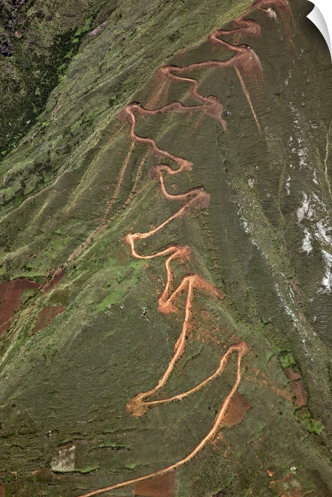 Peru. A trail zigzags up a steep ridge on the Andean Mountains east of Cusco.