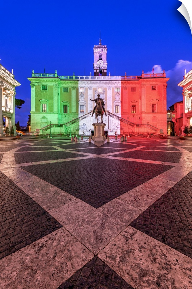 Piazza del Campidoglio with Palazzo Senatorio illuminated with the colors of the Italian flag, Rome, Lazio, Italy