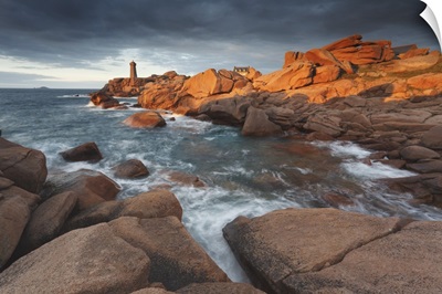 Pink Granite coast, Brittany, France. The Ploumanach lighthouse an sunset
