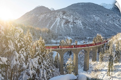 Red Train In Winter Landscape From Filisur To Tiefencastel Railway Station, Switzerland