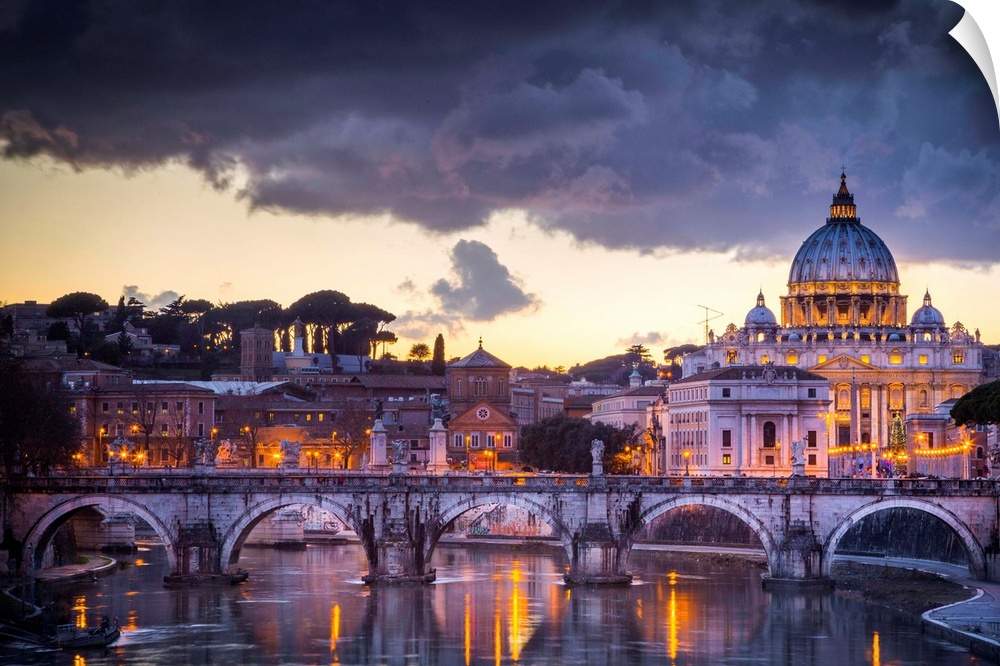 Rome, Lazio, Italy. Sunset on Tevere River, with Saint Peter Cathedral on the background.