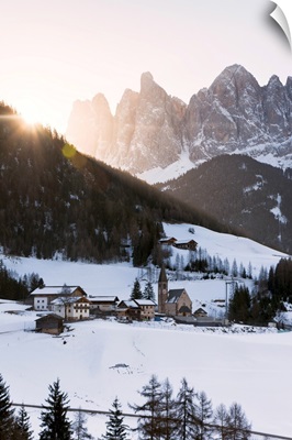 Sankt Magdalena in a winter sunrise in Funes valley, Odle Natural park in Italy