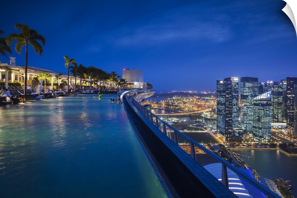Singapore, Marina Bay Sands Hotel, rooftop swimming pool, dusk.