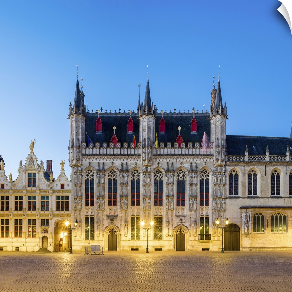 Belgium, West Flanders (Vlaanderen), Bruges (Brugge). Stadhuis van Brugge city hall on Burg Square at dusk.