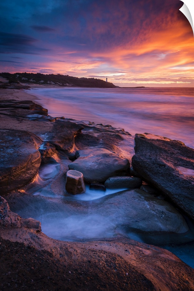 Stunning sunrise looking over to Norah Head Lighthouse. Gravelly Beach, Central Coast, New South Wales, Australia