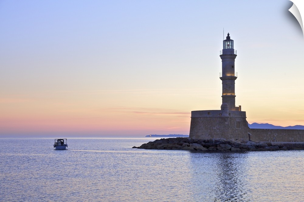 The Lighthouse and Fishing Boat in The Venetian Harbour at Sunrise, Chania, Crete, Greek Islands, Greece, Europe