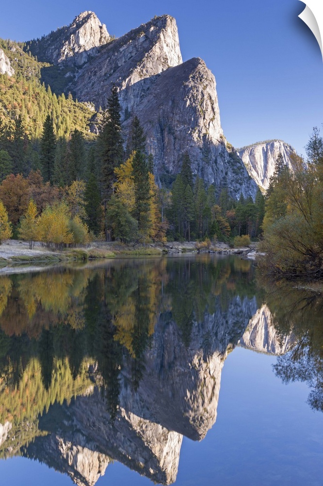 The Three Brothers reflected in the Merced River at dawn, Yosemite Valley, California, USA. Autumn (October)