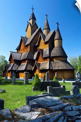 Tourists checking map beside Heddal Stave Church, Norway
