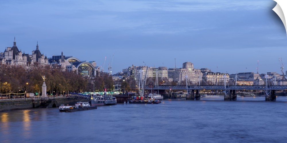 View over River Thames towards Hungerford Bridge and Charing Cross Station, London, England, United Kingdom