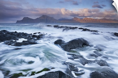 Waves break over the rocky shores at Gjogv on the island of Eysturoy, Faroe Islands