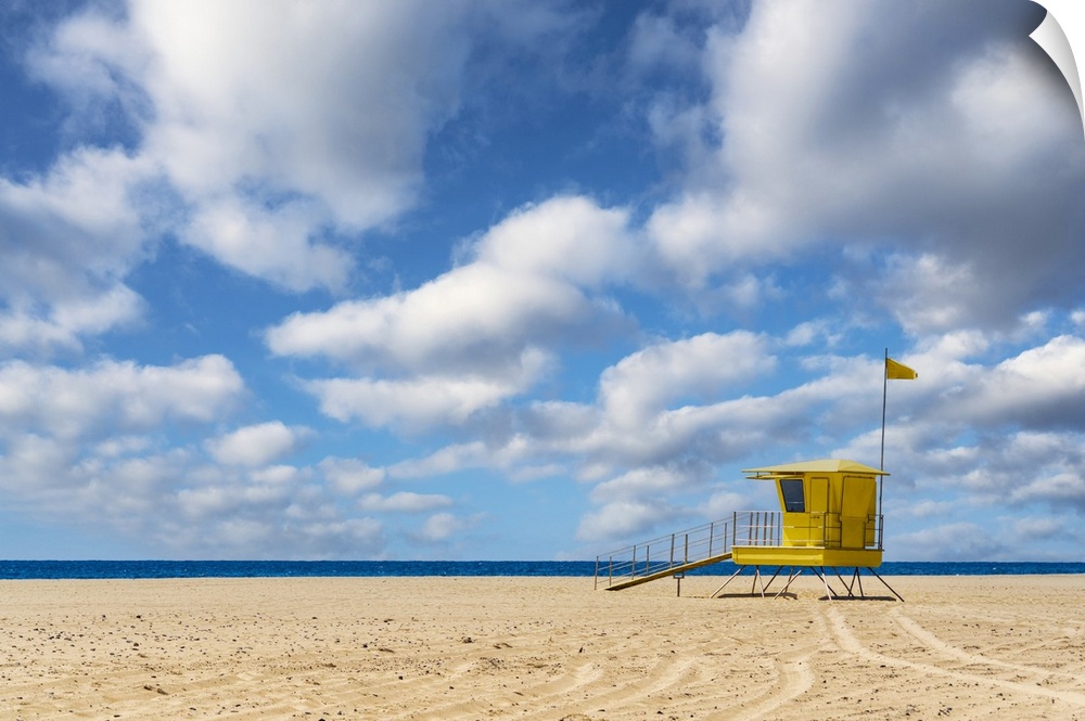 Yellow lifeguard's cabin on empty sand beach, Morro Jable, Fuerteventura, Canary Islands, Spain.