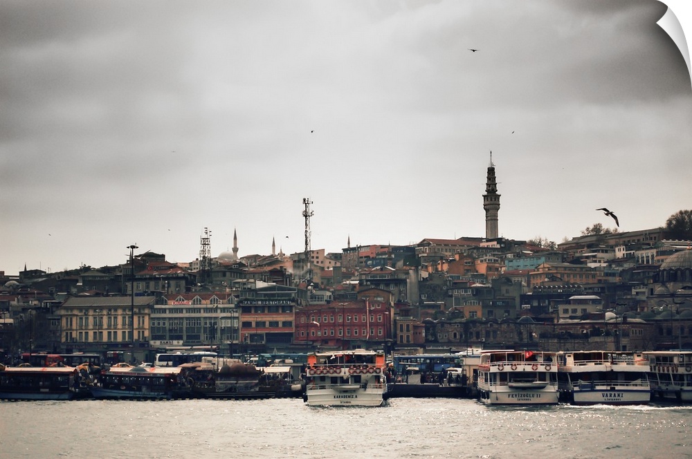 An offshore look of Istanbul from the Bosphorus River looking onto the mainland. Istanbul's skyline is filled with minaret...