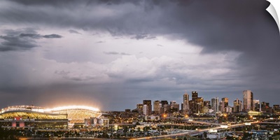 Sun sets over Denver during a Bronco's football game, Denver, Colorado
