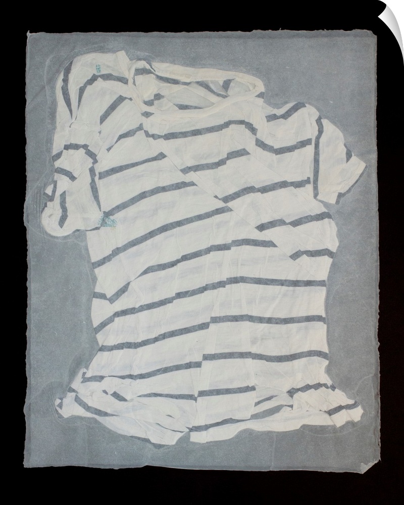 A striped, torn and mended t-shirt suspended in handmade paper.