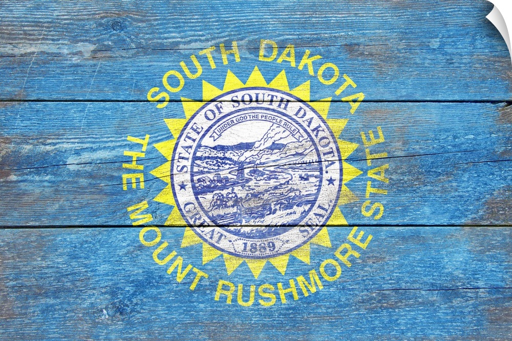 The flag of South Dakota with a weathered wooden board effect.