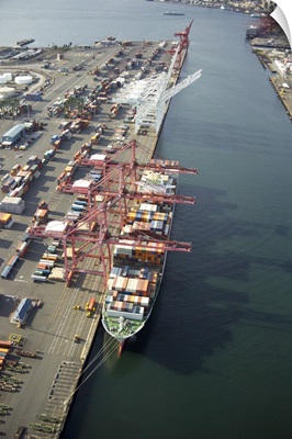 Cranes loading a container ship at Port of Seattle, WA, USA - Aerial Photograph