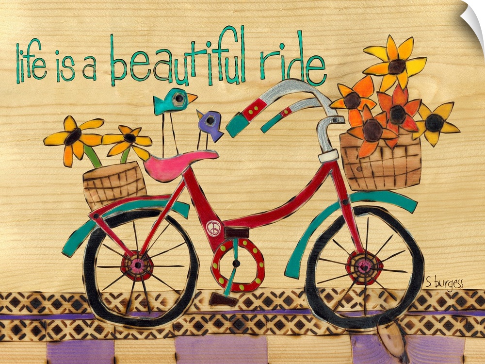 Bike with basket full of flowers and saying