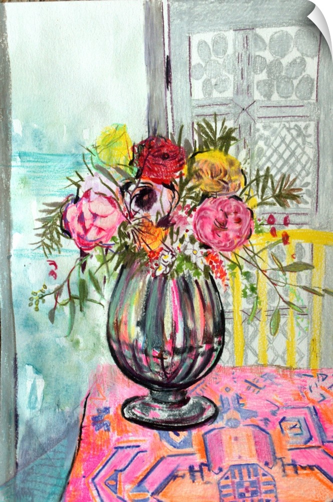 A vase of flowers on a table with a pink cloth.