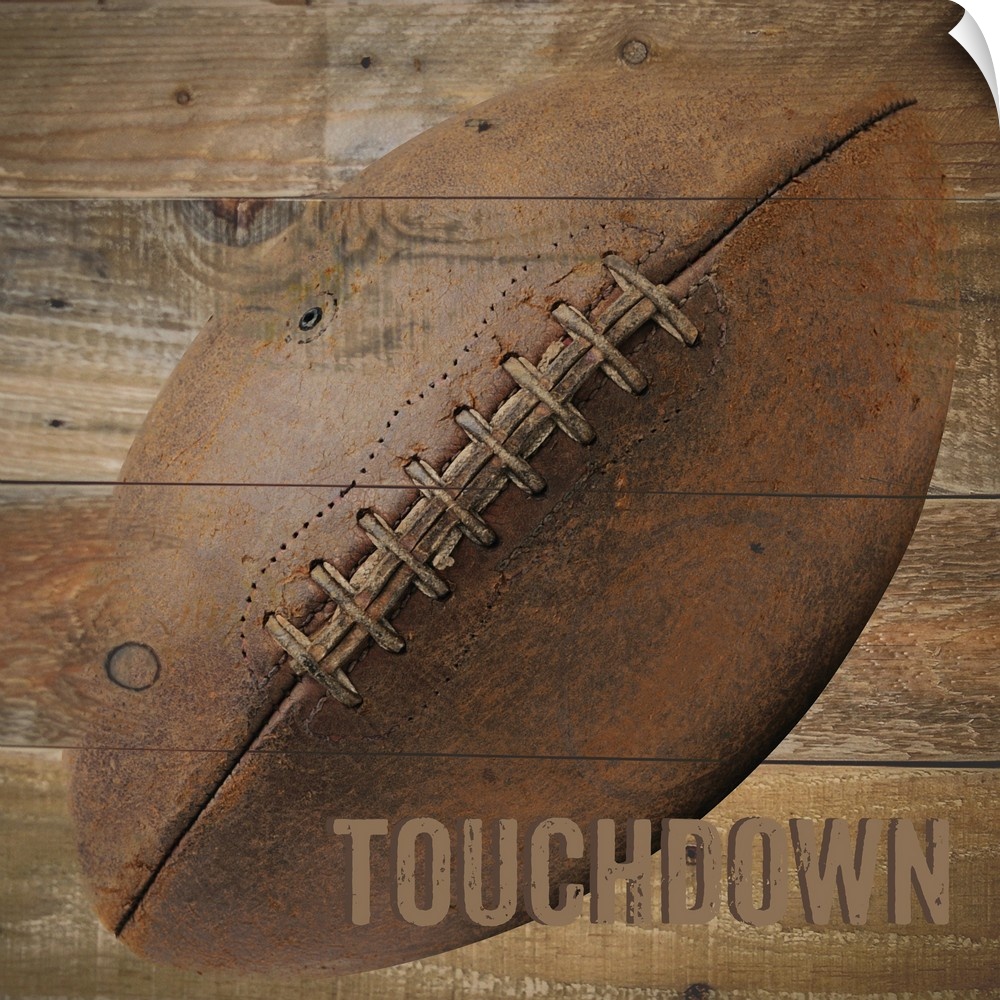 Image of a football with the word "Touchdown" on a wooden background.