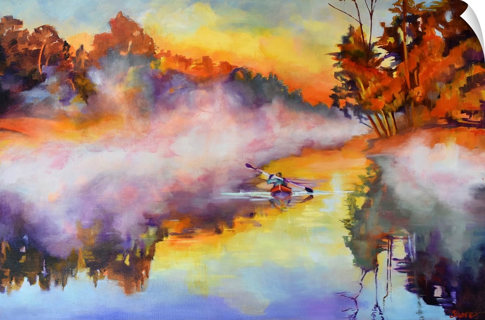 Kayaker on a lake on a misty morning.
