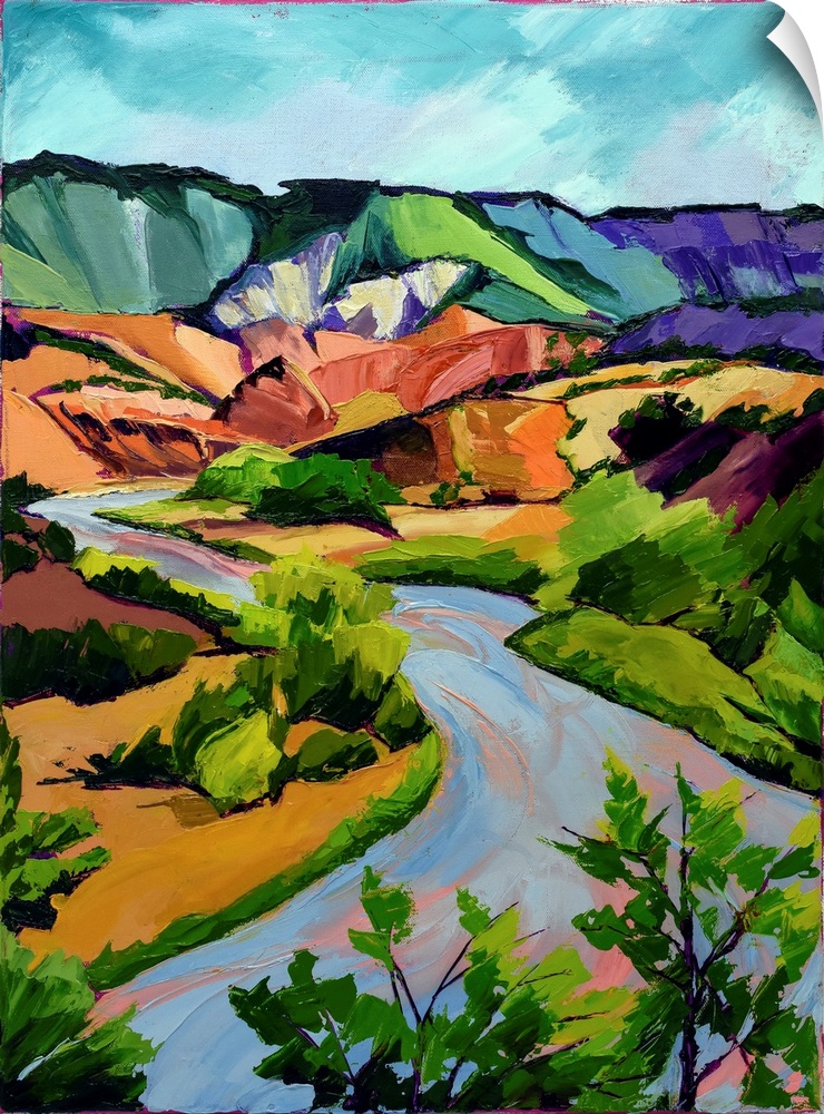 Scene in New Mexico of mountains, river, and valley in vivid colors.