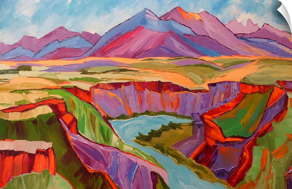 View of Southwest with mountains, river, and cliffs in vivid color.