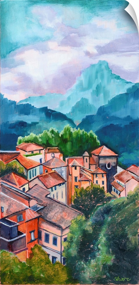 Village in Tuscany with mountains in distance.