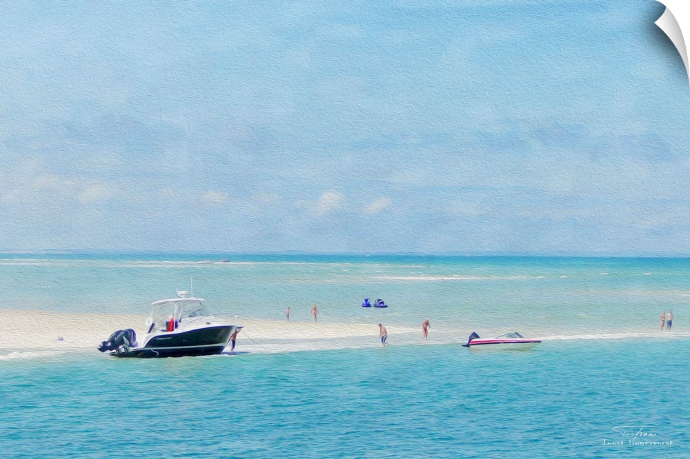 A boat at the edge of a sandy beach with jet skis on the water.