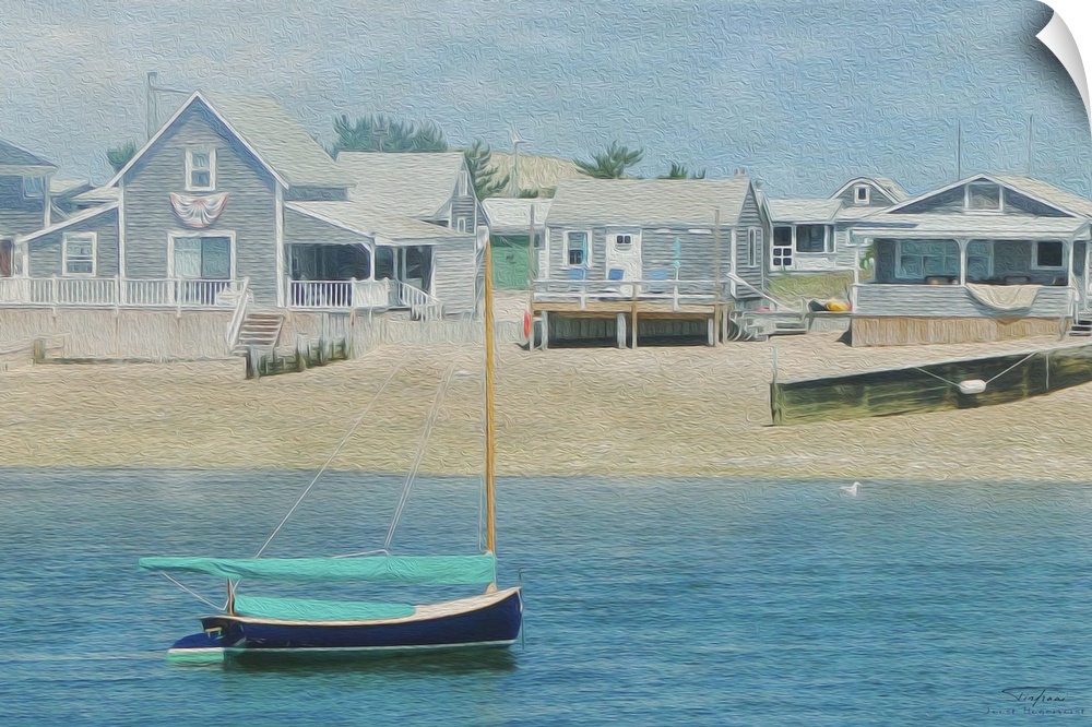 Beach houses with wooden piers near the ocean with a small boat on the water.