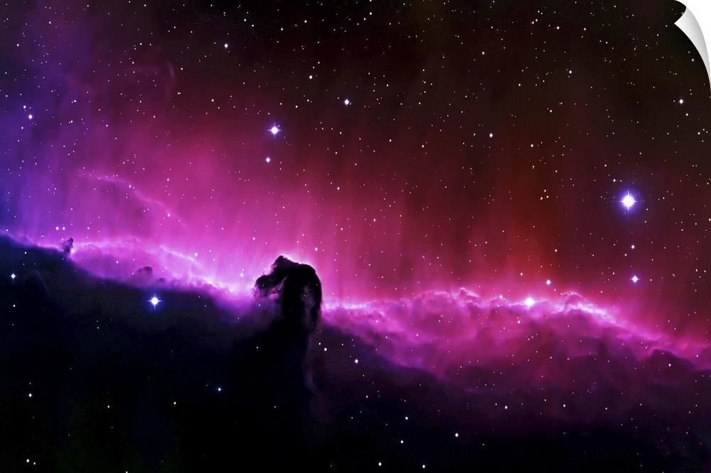 Big wall art of a brightly colored nebula in the solar system with clouds that look like a horse's head.