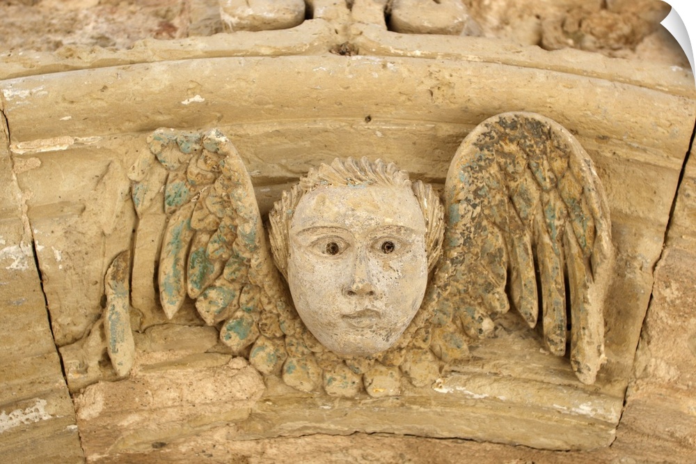 Italy, Apulia, Otranto, angel carved in stone in a door archway