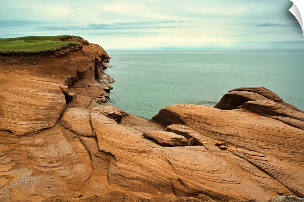 Canada, Quebec,  Iles-de-la-Madeleine: red cliffs and ocean.