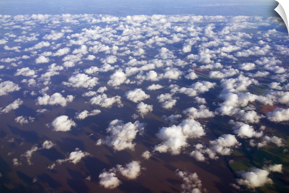 Scattered clouds, aerial over Rio de la Plata, Argentina.