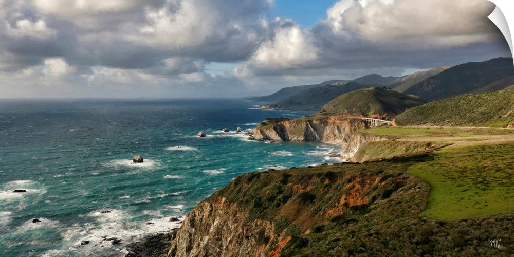 A view of the Big Sur coastline from Hurricane Point, with the Bixby Creek Bridge glowing in the sunlight.