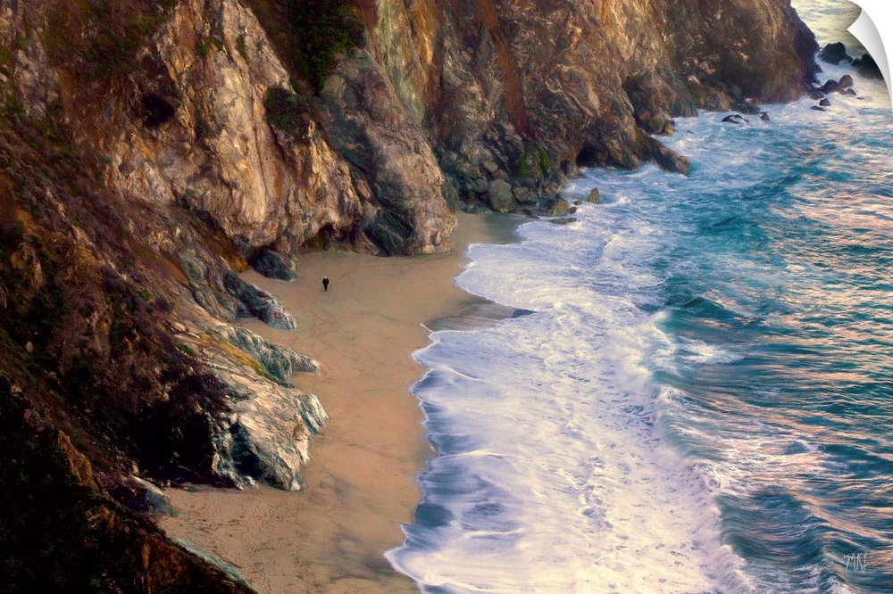 About 250 feet below the Bixby Bridge lies a beautiful beach where a local takes an afternoon stroll. His size relative to...
