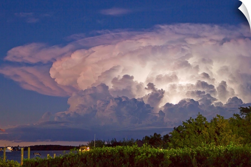 A supercell anvil cloud filled with discharging electricity.