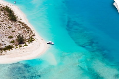 An aerial view of boat pulled ashore on a private island in the Turks and Caicos